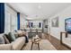 Inviting living room seamlessly connects to the kitchen, perfect for entertaining at 5202 Reed St, Arvada, CO 80002