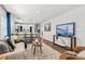Comfortable living room with a couch, chairs, rug, and TV with kitchen view at 5202 Reed St, Arvada, CO 80002