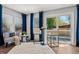 Cozy living room with a door to the exterior deck at 5202 Reed St, Arvada, CO 80002