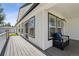 Covered porch with outdoor seating and a view of the front yard at 5202 Reed St, Arvada, CO 80002