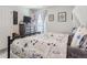 Cozy bedroom features a comfortable bed, dresser with TV and charming decor, creating a peaceful retreat at 5995 Fencerow Pl, Brighton, CO 80601