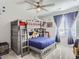 Charming bedroom with a bunk bed and window at 5995 Fencerow Pl, Brighton, CO 80601