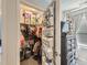Organized Bedroom closet with baby clothes and supplies, next to dresser and TV at 5995 Fencerow Pl, Brighton, CO 80601