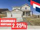 Inviting two-story home featuring a three-car garage and a charming front porch, creating a welcoming curb appeal at 5995 Fencerow Pl, Brighton, CO 80601