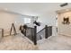 Hallway with mounted deer head, dark wood railing and stairway at 5995 Fencerow Pl, Brighton, CO 80601