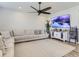 Living room showcases a large sectional sofa and a television for relaxation and entertainment at 5995 Fencerow Pl, Brighton, CO 80601