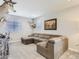 The living room boasts a spacious seating area and unique mounted deer heads at 5995 Fencerow Pl, Brighton, CO 80601