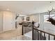 Cozy loft area with mounted deer heads, seating, and stairway at 5995 Fencerow Pl, Brighton, CO 80601