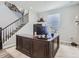 Well-lit home office with a large wooden desk, creating a functional and productive workspace at 5995 Fencerow Pl, Brighton, CO 80601