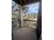 The balcony has wood floors and metal railings and lots of tree views at 17346 Nature Walk Trail Trl # 201, Parker, CO 80134