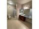 The bathroom features double sinks with a granite countertop and a shower and toilet at 17346 Nature Walk Trail Trl # 201, Parker, CO 80134