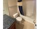 Compact bathroom featuring a tub with shower and toilet, offering functionality in a cozy space at 17346 Nature Walk Trail Trl # 201, Parker, CO 80134