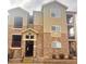 Three-story condo building with stone accents and multiple balconies at 17346 Nature Walk Trail Trl # 201, Parker, CO 80134