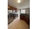 Modern kitchen with stainless steel appliances, granite counters, and a breakfast bar at 17346 Nature Walk Trail Trl # 201, Parker, CO 80134