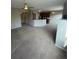 Open-concept living area with kitchen view at 17346 Nature Walk Trail Trl # 201, Parker, CO 80134