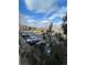 Exterior shot of a community parking lot with Mountain views and well-maintained landscaping at 17346 Nature Walk Trail Trl # 201, Parker, CO 80134