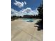 Exterior shot of a community pool with jacuzzi, lounge chairs, and a well-maintained swimming area at 17346 Nature Walk Trail Trl # 201, Parker, CO 80134