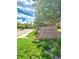 Entrance to Prairie Walk on Cherry Creek featuring stone signage and mature landscaping at 17346 Nature Walk Trail Trl # 201, Parker, CO 80134
