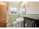 Charming bathroom with a classic pedestal sink, and beadboard accent walls at 6086 W Arizona Ave, Lakewood, CO 80232