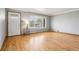 Light filled living room features hardwood flooring and fresh neutral paint, creating a bright and inviting atmosphere at 6086 W Arizona Ave, Lakewood, CO 80232
