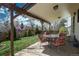 Covered back patio with outdoor seating, perfect for relaxing and entertaining guests at 15930 E Ford Pl, Aurora, CO 80017