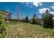 Spacious backyard with lush lawn, ideal for outdoor activities and relaxation at 15930 E Ford Pl, Aurora, CO 80017
