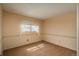Comfortable bedroom with carpet, bright window and neutral colored walls at 15930 E Ford Pl, Aurora, CO 80017
