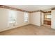 Bright bedroom features two windows and a vanity with mirror and sink at 15930 E Ford Pl, Aurora, CO 80017