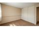 Bedroom featuring neutral walls, carpet and a large closet at 15930 E Ford Pl, Aurora, CO 80017
