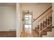 The home's entryway includes wood floors and stair access to the second level at 15930 E Ford Pl, Aurora, CO 80017