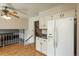 Open kitchen featuring white appliances and a view of the Gathering room at 15930 E Ford Pl, Aurora, CO 80017