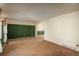 Spacious living room featuring neutral carpet and walls at 15930 E Ford Pl, Aurora, CO 80017