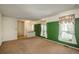 Bright living room with neutral carpet and paint with decorative curtains at 15930 E Ford Pl, Aurora, CO 80017