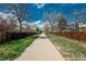 Scenic path lined with trees and greenery, perfect for walking and enjoying nature at 15930 E Ford Pl, Aurora, CO 80017