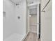 Clean basement bathroom, featuring a shower and vinyl flooring at 6087 W 61St Pl, Arvada, CO 80003