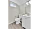 Basement bathroom with white vanity and vinyl flooring at 6087 W 61St Pl, Arvada, CO 80003