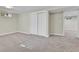 Finished basement bedroom with grey carpet and access to other rooms at 6087 W 61St Pl, Arvada, CO 80003