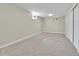 Finished basement bedroom with grey carpet and double doors at 6087 W 61St Pl, Arvada, CO 80003