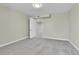 Bright finished basement bedroom with grey carpet and an open doorway at 6087 W 61St Pl, Arvada, CO 80003