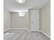 Finished basement bedroom with grey carpet and ample closet space at 6087 W 61St Pl, Arvada, CO 80003