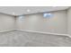 Finished basement offers ample space with neutral walls and carpeting at 6087 W 61St Pl, Arvada, CO 80003