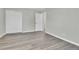 Bright bedroom with grey vinyl flooring and double door closet at 6087 W 61St Pl, Arvada, CO 80003