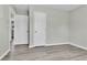 Spacious bedroom with double closets and wood-look vinyl flooring at 6087 W 61St Pl, Arvada, CO 80003