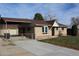 House exterior showcasing front yard, driveway, and landscaping at 6087 W 61St Pl, Arvada, CO 80003