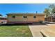 House exterior showcasing brick and landscaping at 6087 W 61St Pl, Arvada, CO 80003