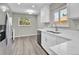 Updated kitchen featuring stainless steel appliances and ample counter space at 6087 W 61St Pl, Arvada, CO 80003