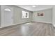 Bright and airy living room with vinyl flooring and neutral color palette at 6087 W 61St Pl, Arvada, CO 80003