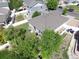 Aerial view of the back of the property with patio furniture and landscaping at 20194 Robins Dr, Denver, CO 80249