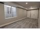 Basement bedroom with carpet, large window, and closet doors at 20194 Robins Dr, Denver, CO 80249