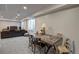 Finished basement features an open space with a sitting area and a table for games or crafts at 20194 Robins Dr, Denver, CO 80249